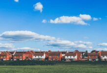 Why Investing in Valldemossa’s Real Estate is Never a Dull Day houses beside grass field