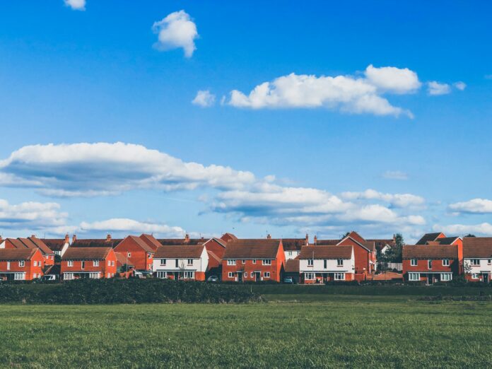 Photo by Trayan houses beside grass field