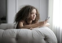 How Pussy88 Keeps Your Login Secure: A Look at Their Security Protocols Photo of Woman Sitting on a Gray Bean Bag While Using Her Phone