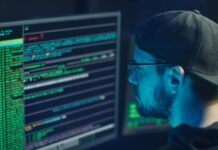 CISO Advisory: A Key to Navigating Cyber Threats in a Digital World Man in Blue Crew Neck Shirt Wearing Black Framed Eyeglasses