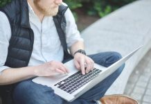 Tips and Strategies for Mastering the Aviator Game man using MacBook while sitting on bench