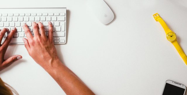 Photo by Damian Zaleski person typing on Apple Cordless Keyboard